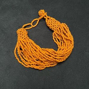 Super nice orange multi-strand beaded bracelet.